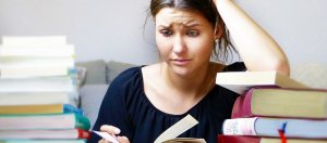 A closeup of a female student reading and studying
