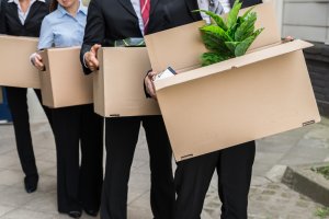 Four persons holding boxes