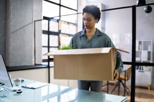A woman holding a big box