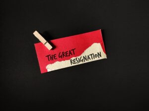 A red piece if a paper with a text saying ‘The Great Resignation’
