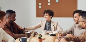 A group of five people having a discussion