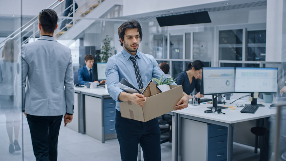 Sad,Fired,/,Let,Go,Office,Worker,Packs,His,Belongings