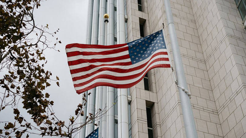 A flag of United States hanging on the wall of a building Montana