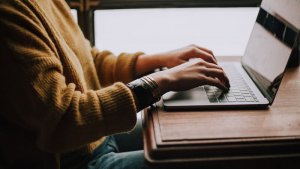 A woman pressing laptop