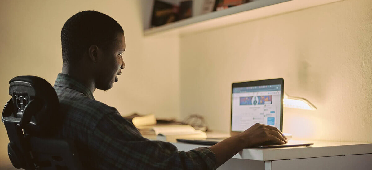 A person sitting behind a laptop - Virginia