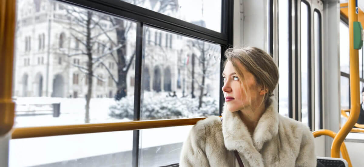 A woman looking out the window of a train - Huntsville