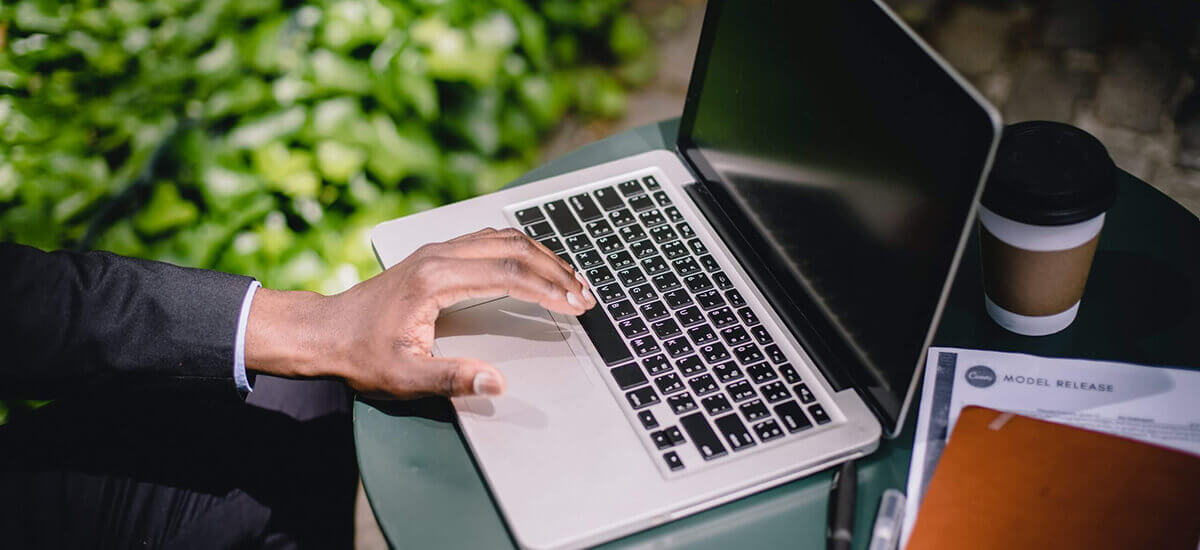 Image of a person trying to click a laptop keyboard - Dallas