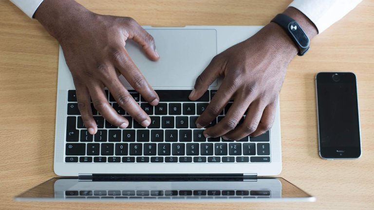 Image of someone pressing laptop Dallas