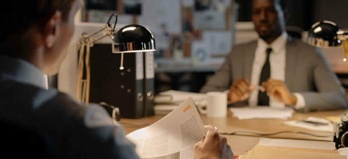 Image of two men sitting in an office - Virginia