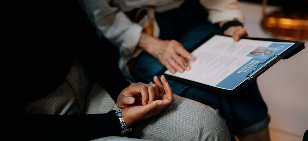 Image of two people sitting together - Huntsville