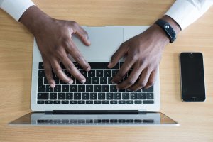 Image of someone pressing laptop