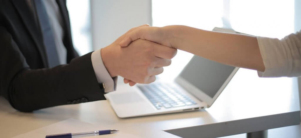 A man and a woman handshaking