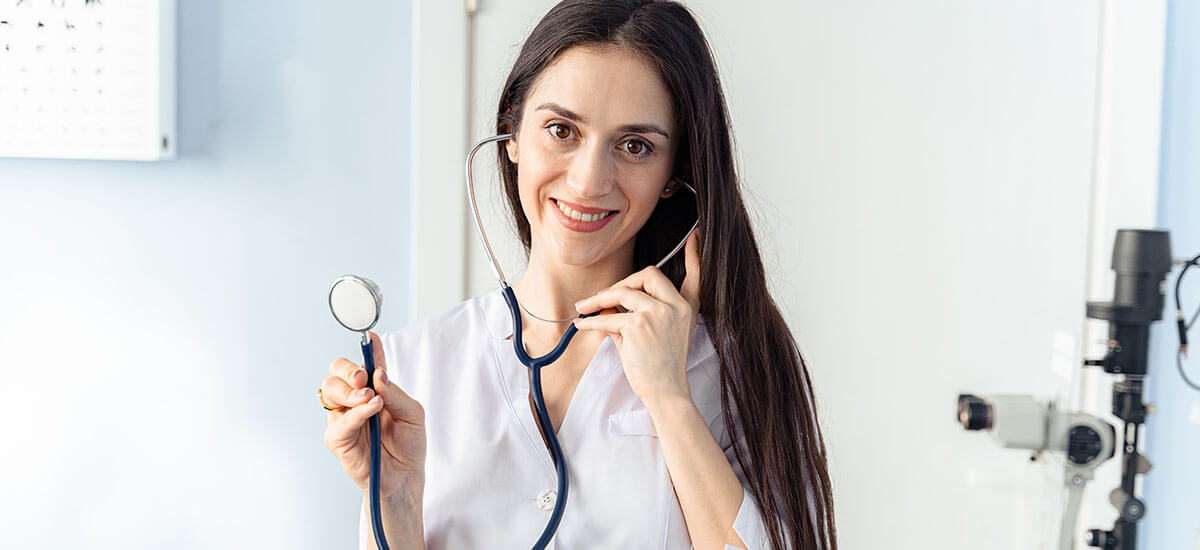A physician holding a stethoscope
