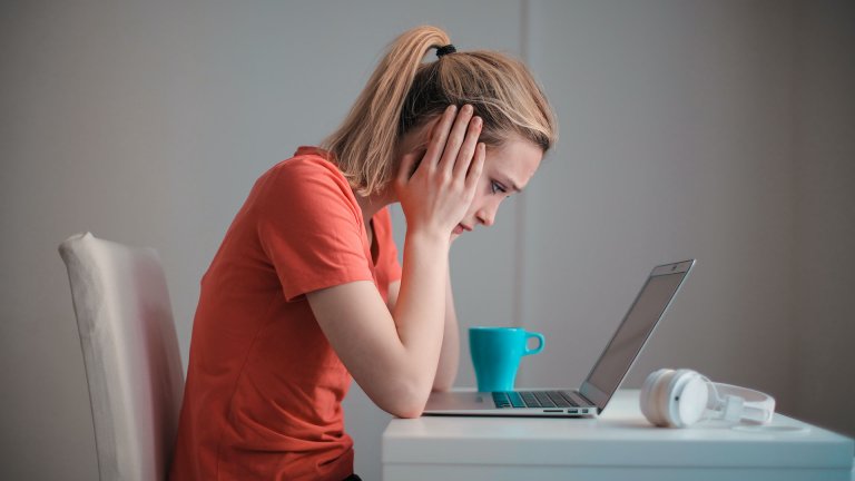 A woman checking a laptop
