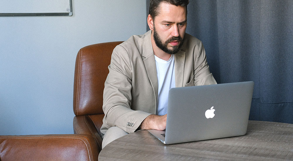 A man pressing a laptop - Dallas County