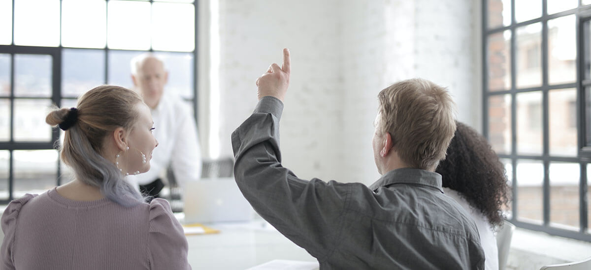 A man raising his hand