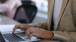 Someone typing on a laptop - Harris County