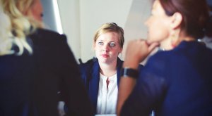 A woman during an interview with two female employers
