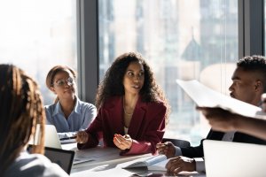 A woman boss fascilitating the meeting discussion