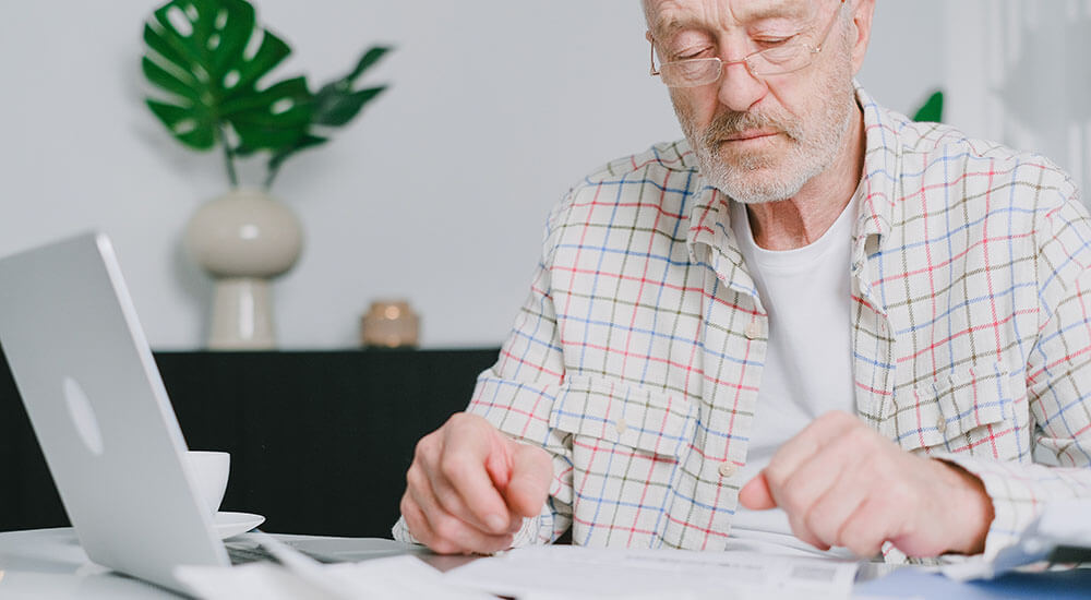 An old man in front of a laptop - Colorado - Careers In Government