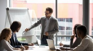 Four people in a room during project discussion
