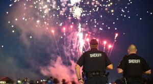 Police sheriff on duty in an event during a fireworks display