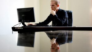 A man using a computer on a desk - Atlanta - Georgia - Careers In Government
