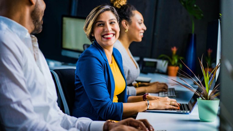 People in an office smiling - Richland County - Careers In Government