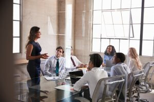 Businesswoman Addressing Colleagues At A Meeting