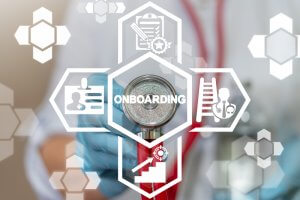 A person wearing gloves holds a stethoscope with a digital overlay featuring healthcare-related icons such as a clipboard, ID badge, ladder, and gear, suggesting steps for onboarding in a medical setting.