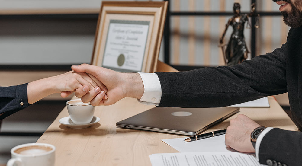 People shaking hands in an office setting - Atlanta Georgia - Careers In Government