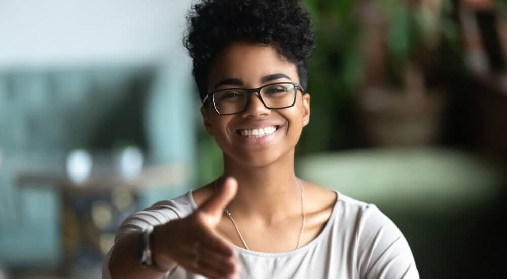 A woman stretching her hand for a handshake - Atlanta Georgia - Careers In Government