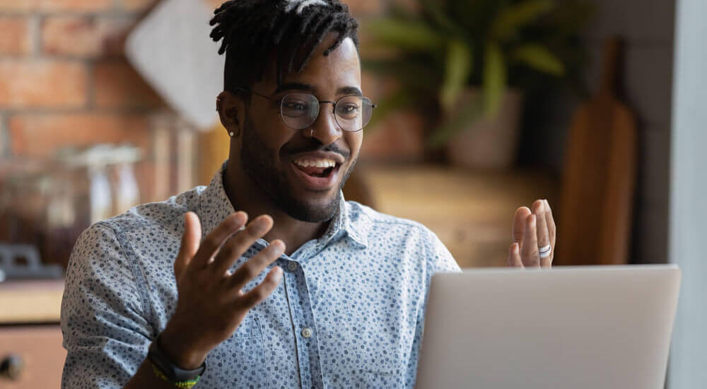 Happy young man having likely an online meeting - Atlanta Georgia - Careers In Government