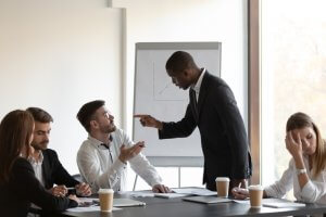 Multi-ethnic business partners having conflict during a meeting