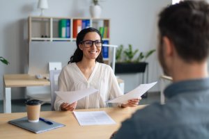 A happy resource manager speaking to an applicant