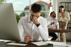 A Man suffering from a toxic environment at work