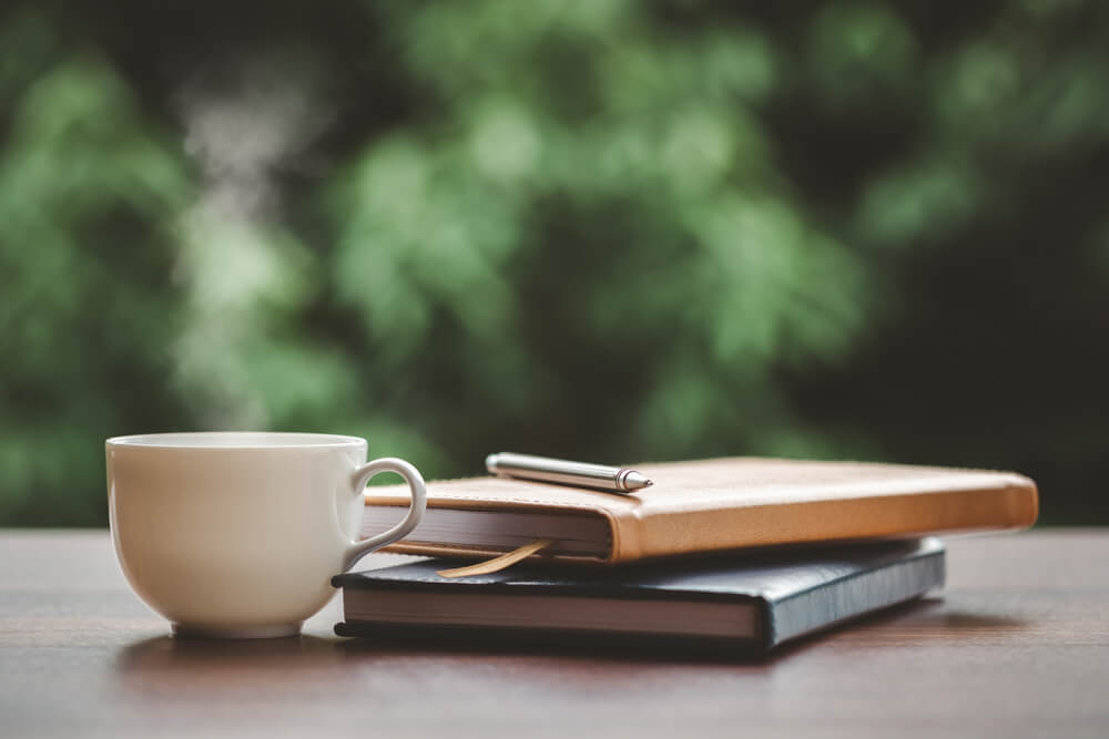 Hot,Coffee,,Smoke,,With,Books,And,Pen,For,Note,Taking