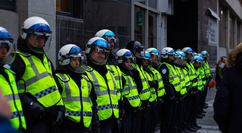 Police unit wearing green vest - Harry Country - Careers In Government