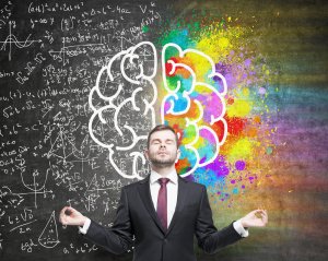 Man standing between an abstract of Right and Left Hemispheres