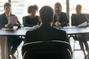 The back view of a male applicant with four employers