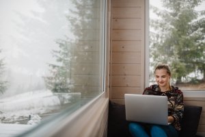 A female working remotely using a laptop