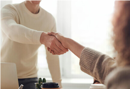 A Man and Woman Shaking Hand - Government IT Jobs - Careers In Government