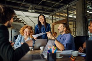 A diverse group of employees happily working on a project