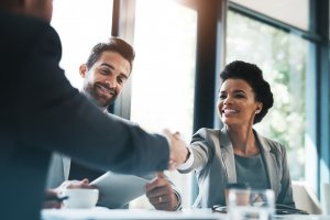 Business people handshaking before the start of a meeting discussion