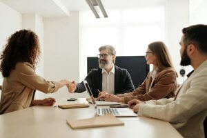 The employer with two employees taking notes and one applicant