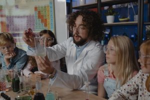 Teacher teaching science; chemical combinations to students