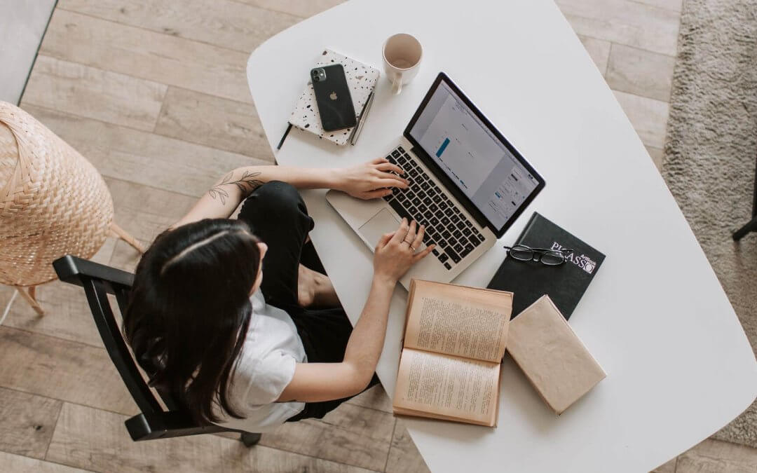 A Woman sitting and searching Job on Laptop