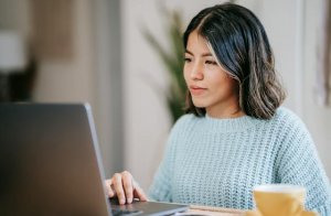 Woman using computer and searching for a job