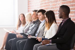 Group of diverse people waiting indoor for their job interview