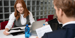 An employee from the HR department discusses contract to new hire